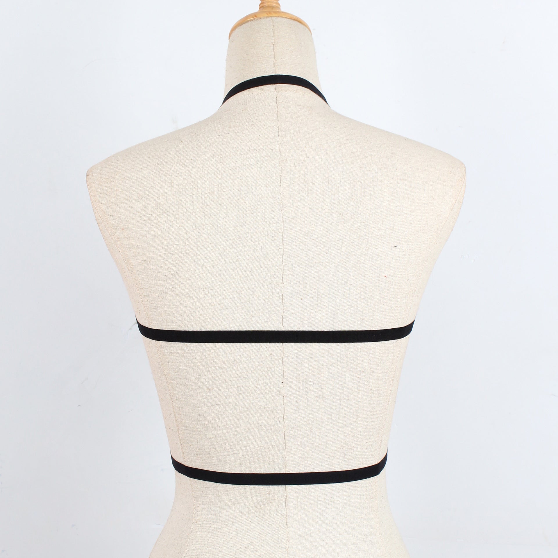 Strap harness bra - back view showing bold design